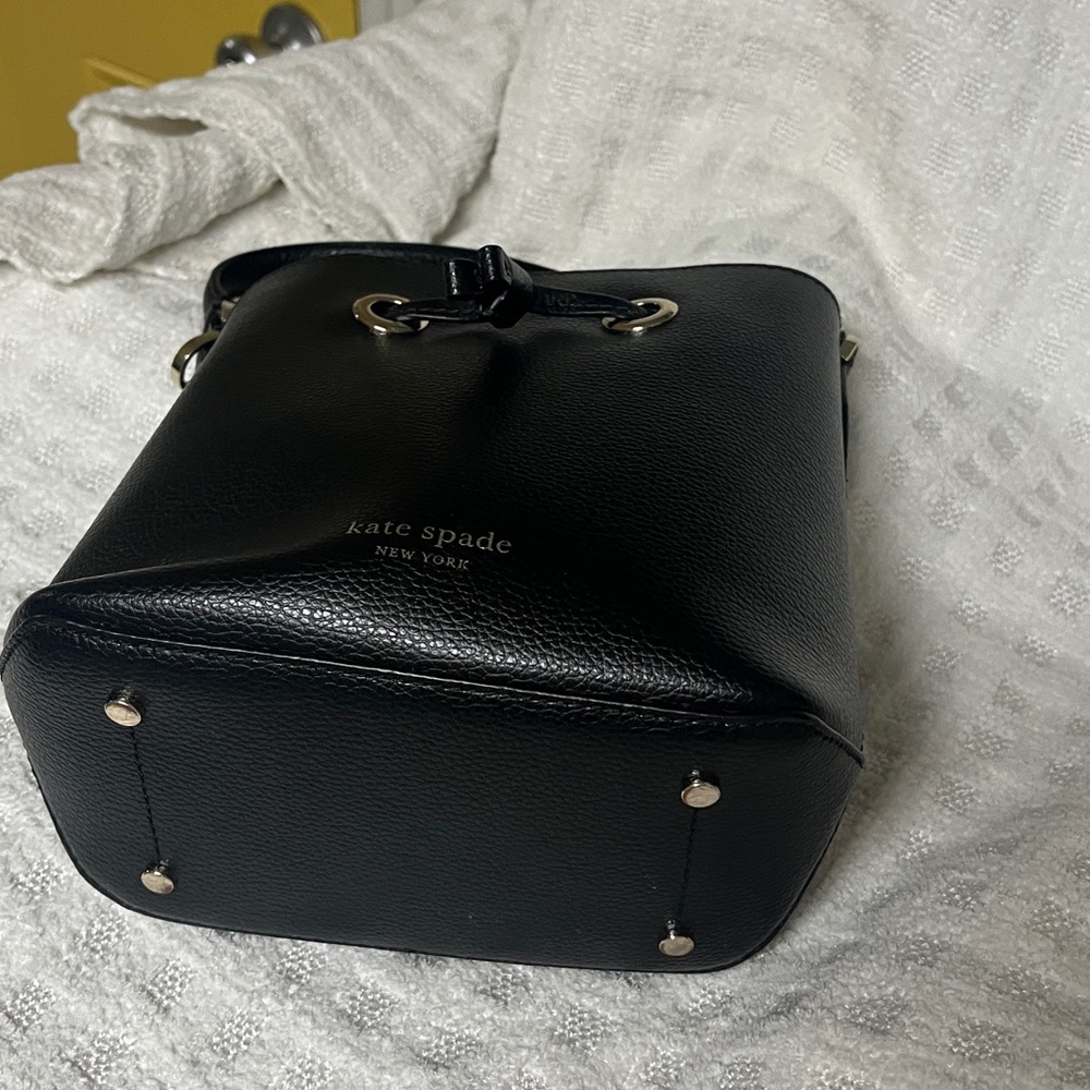 Kate Spade Black mini Bucket Bag.
Does not come with wallet.